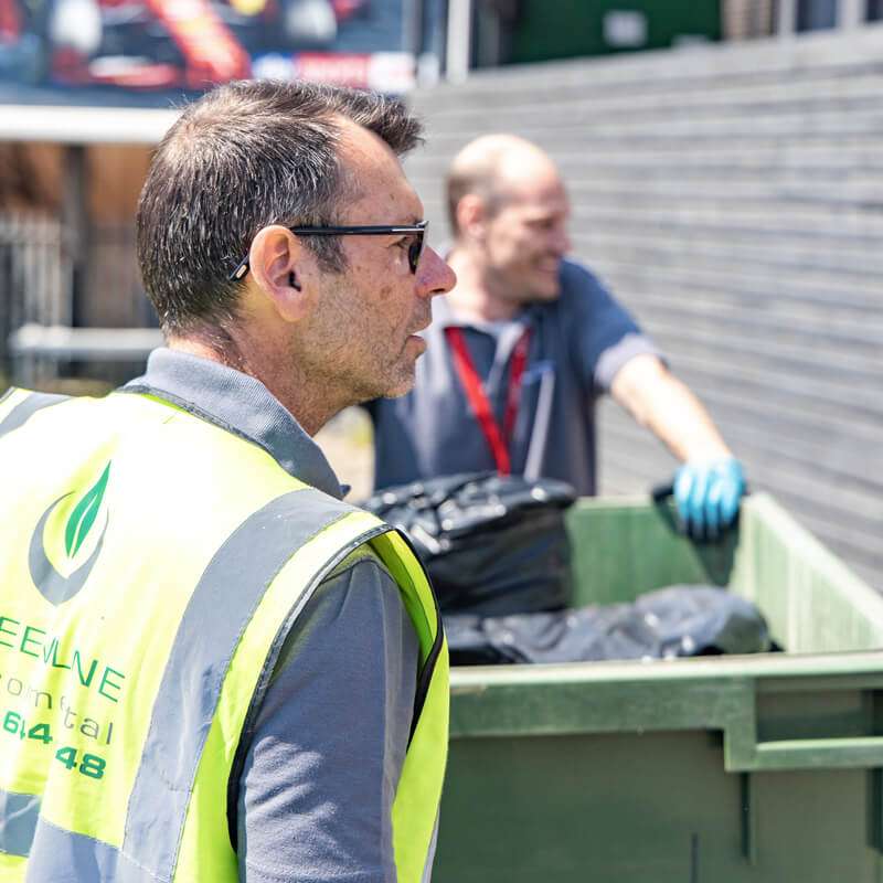 Greenline staff collecting waste