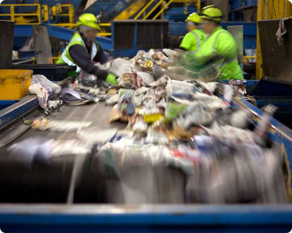 stock-photo-two-garbagemen-working-together-on-emptying-dustbins-for-trash-removal-1017970426-2-5